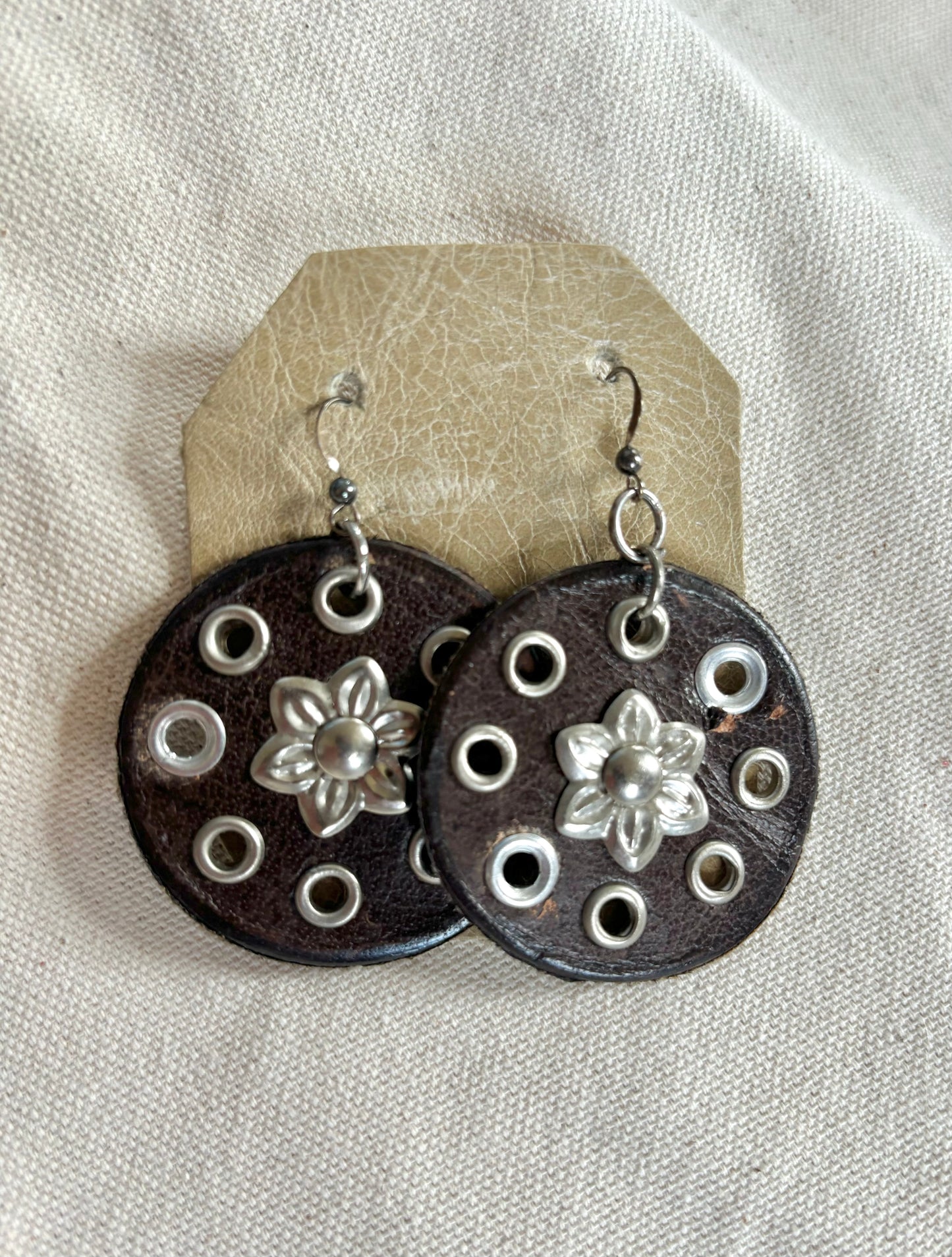 Handmade round leather boho earrings.