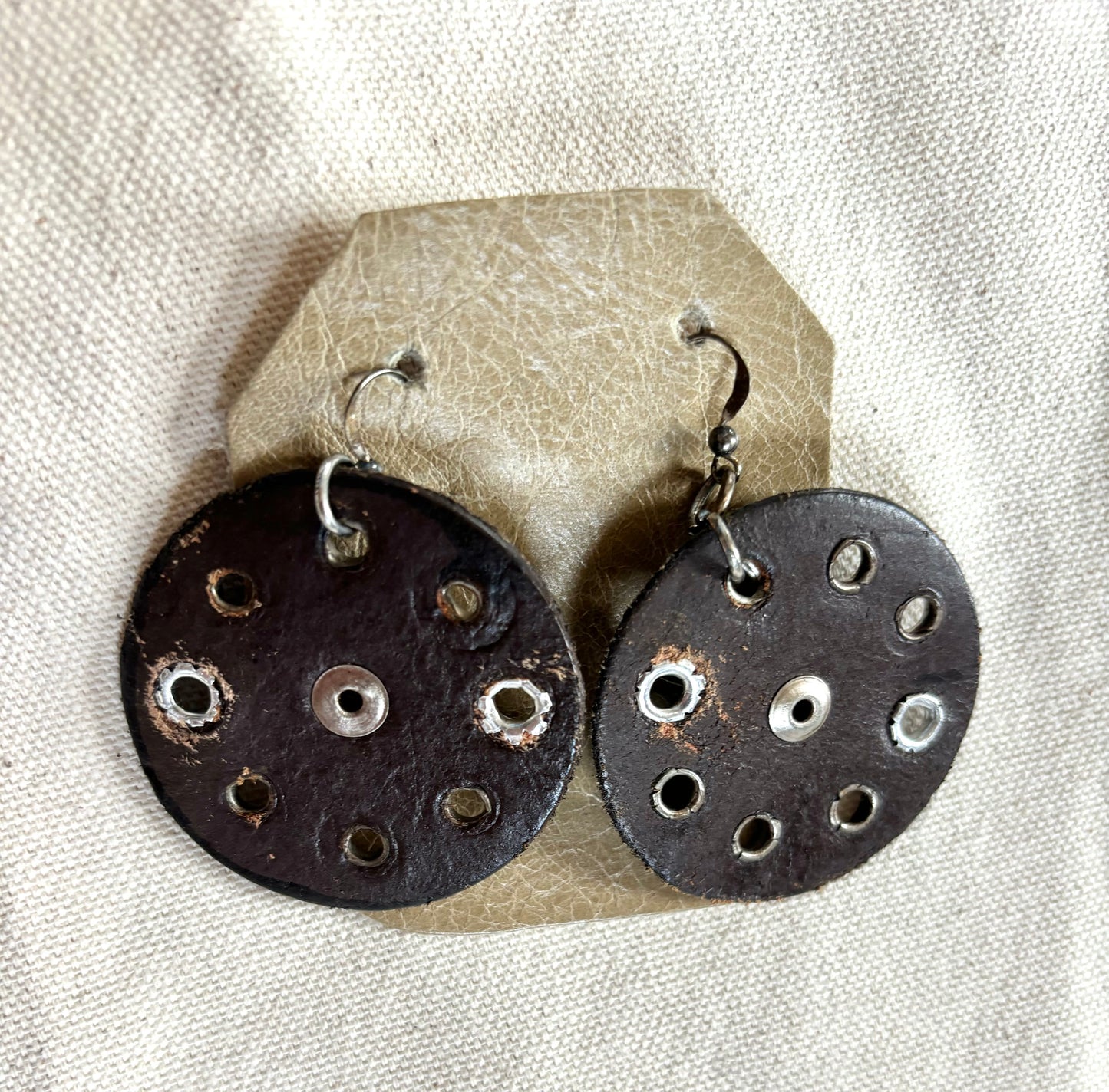 Handmade round leather boho earrings.