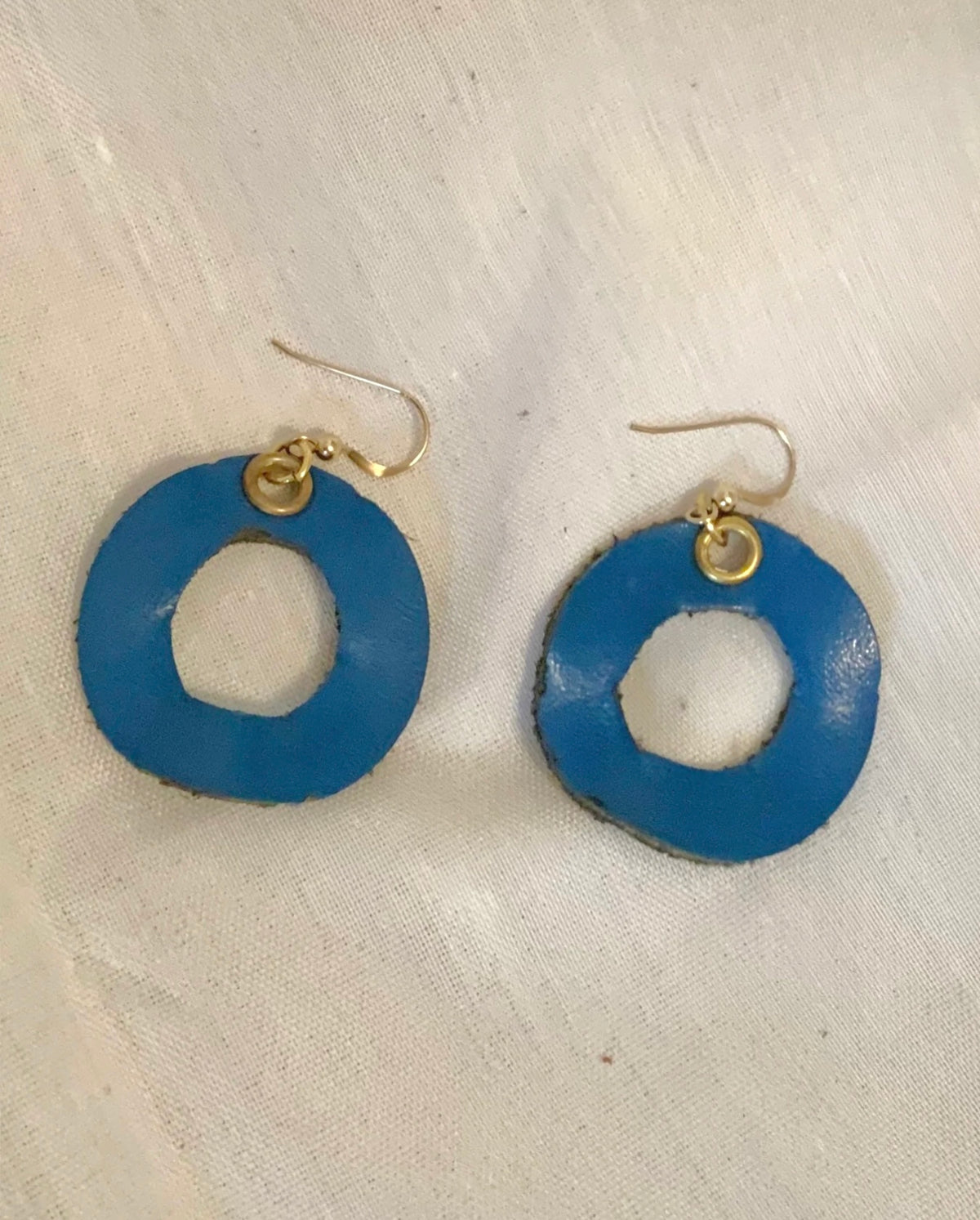 Handmade reclaimed leather circle hoop earrings.