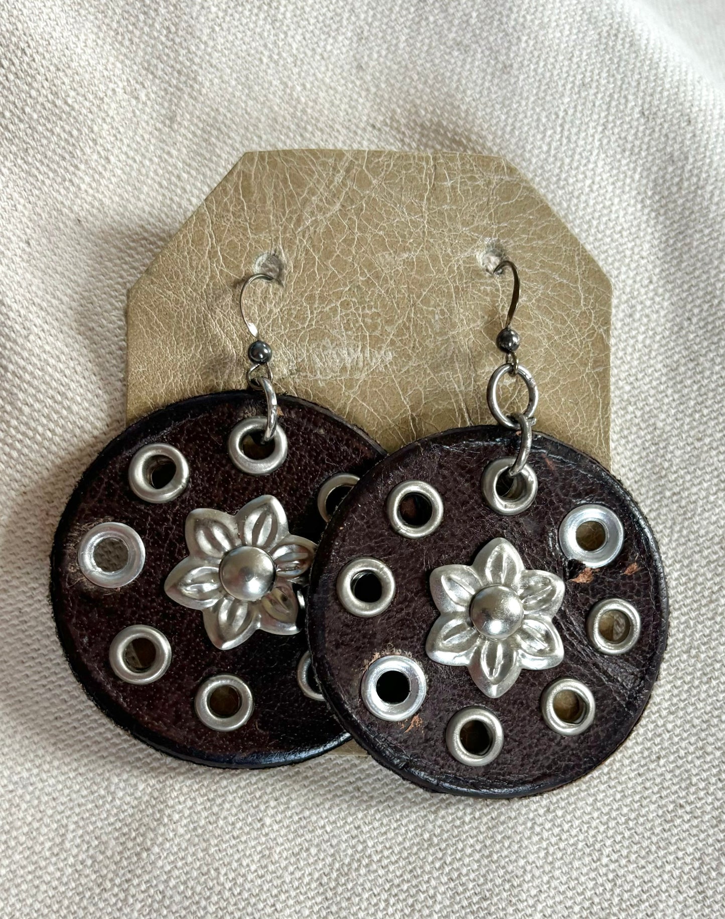 Handmade round leather boho earrings.