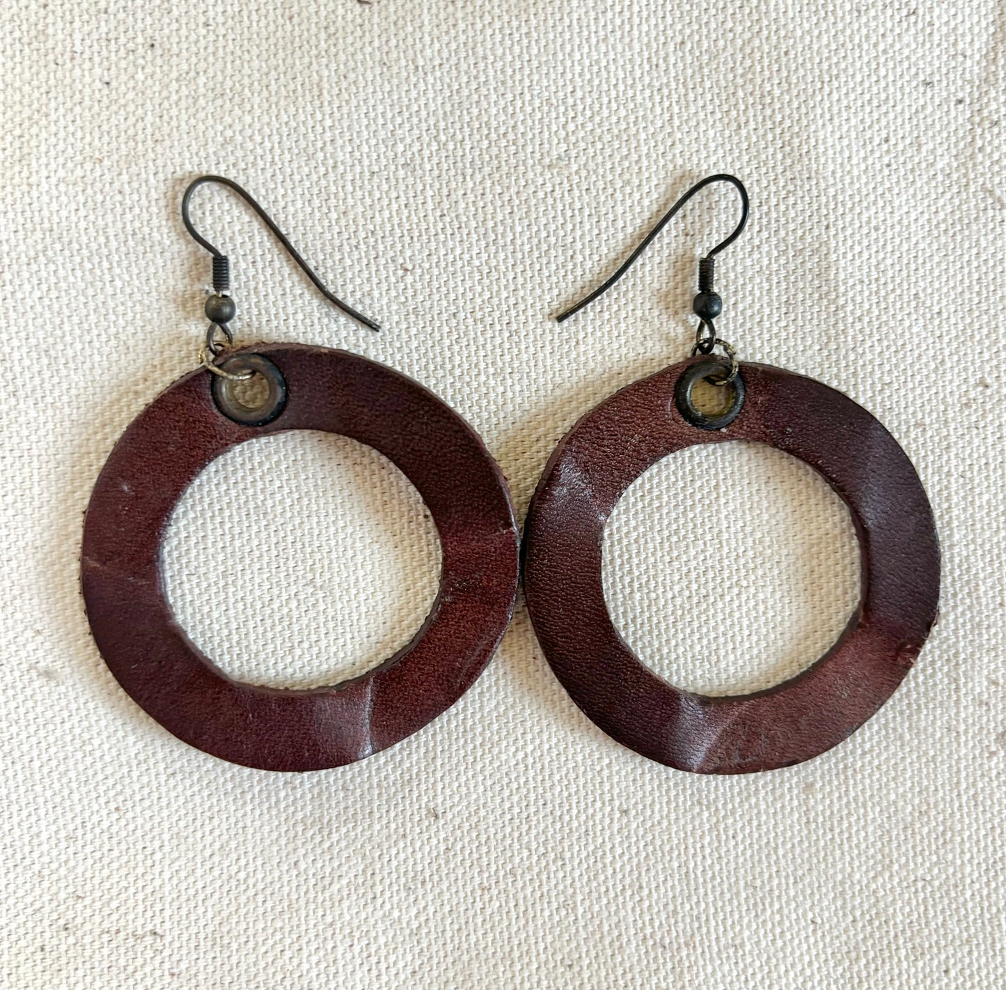 Handmade reclaimed leather circle hoop earrings.