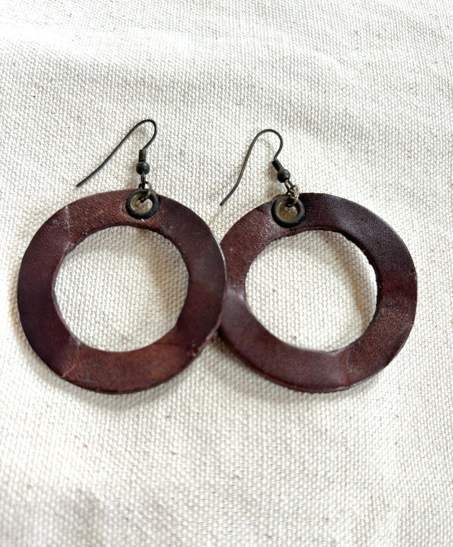 Handmade reclaimed leather circle hoop earrings.