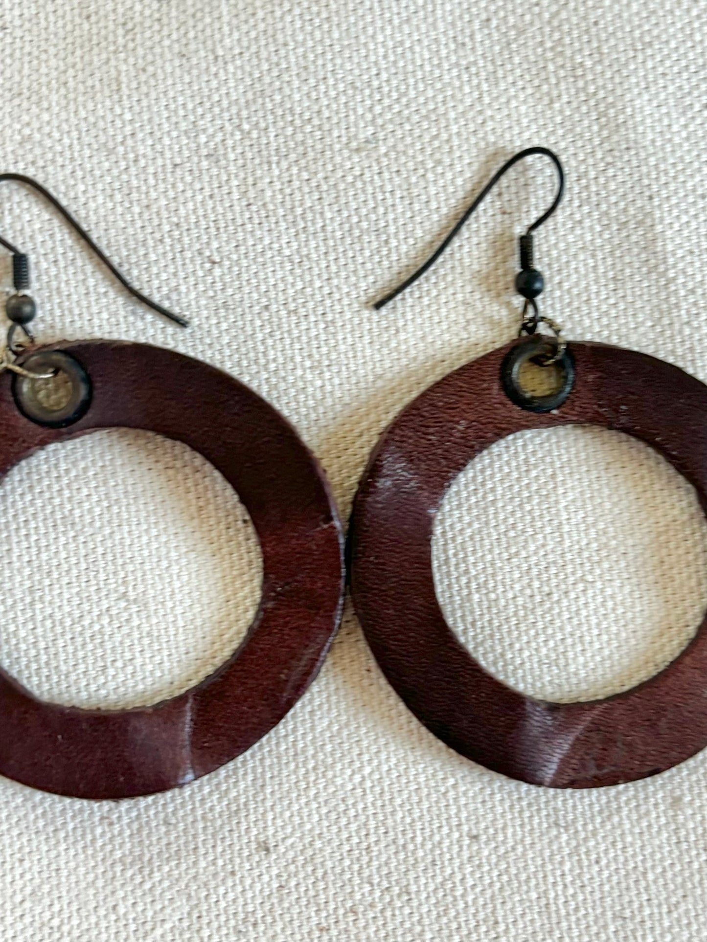 Handmade reclaimed leather circle hoop earrings.