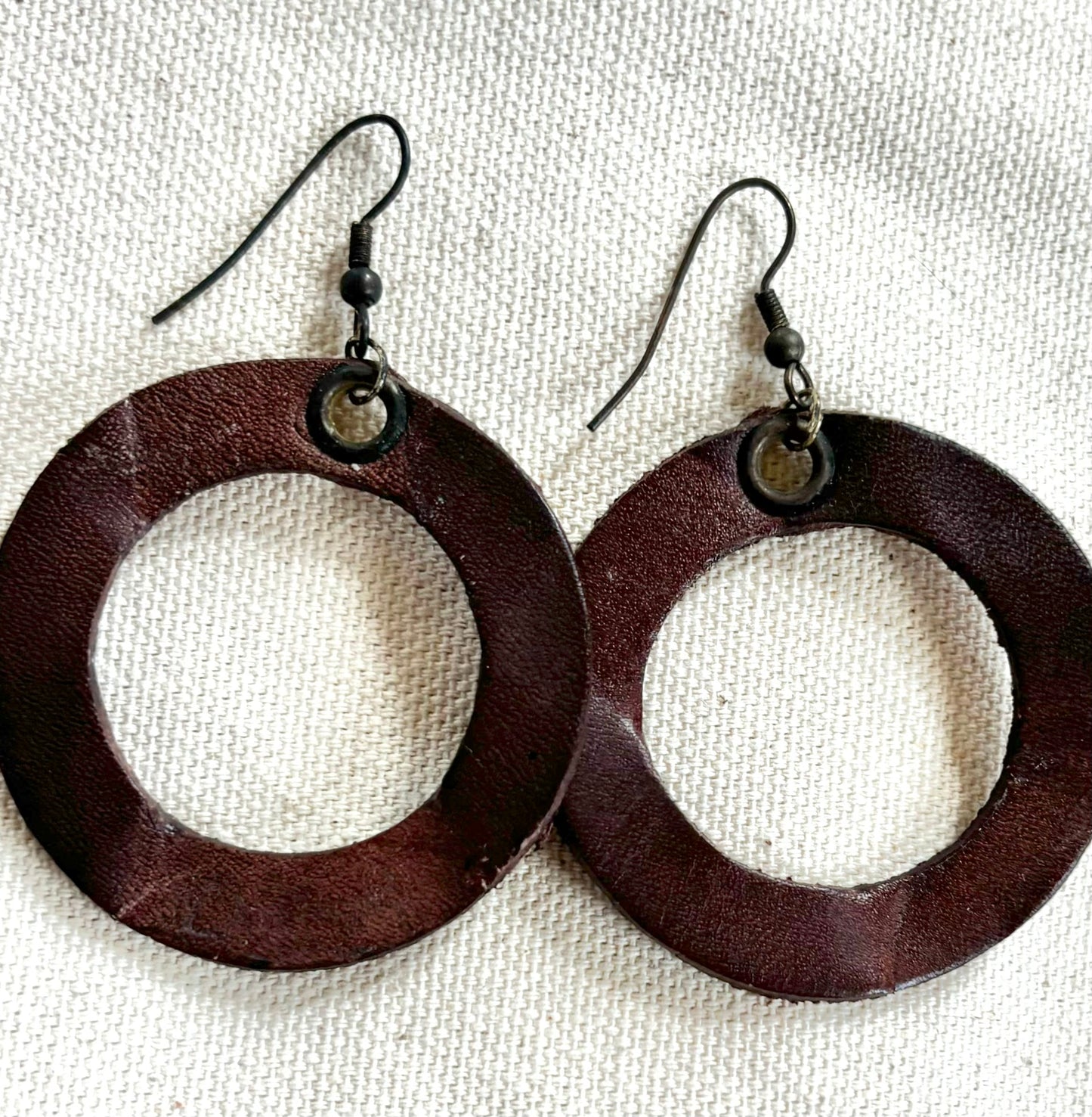 Handmade reclaimed leather circle hoop earrings.